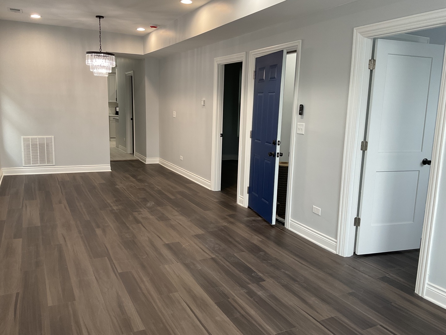 7940 South Carpenter Street, Unit 2 Chicago, IL 60620 - Photo 4 of 34 a view of a room with wooden floor and a ceiling fan