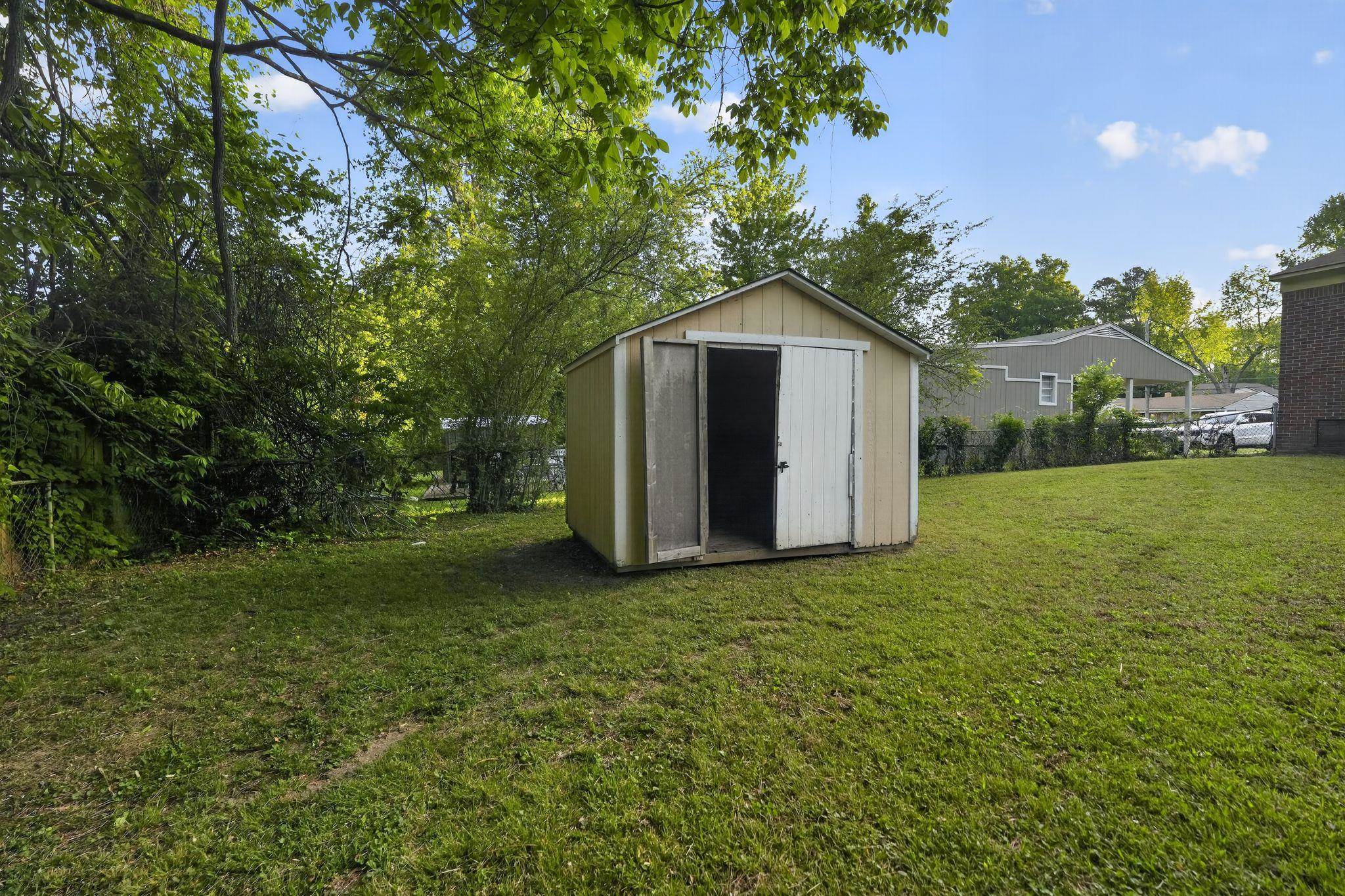 3603 England Street Memphis, TN 38127 - Photo 10 of 36 View of shed with a fenced backyard