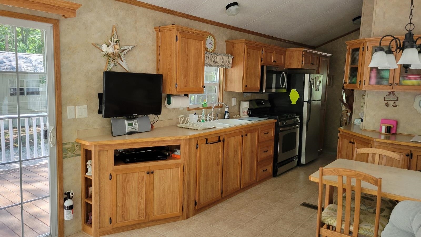 561 Corsons Tavern Road Ocean View, NJ 08230 - Photo 12 of 31 a kitchen that has a sink and a stove in it