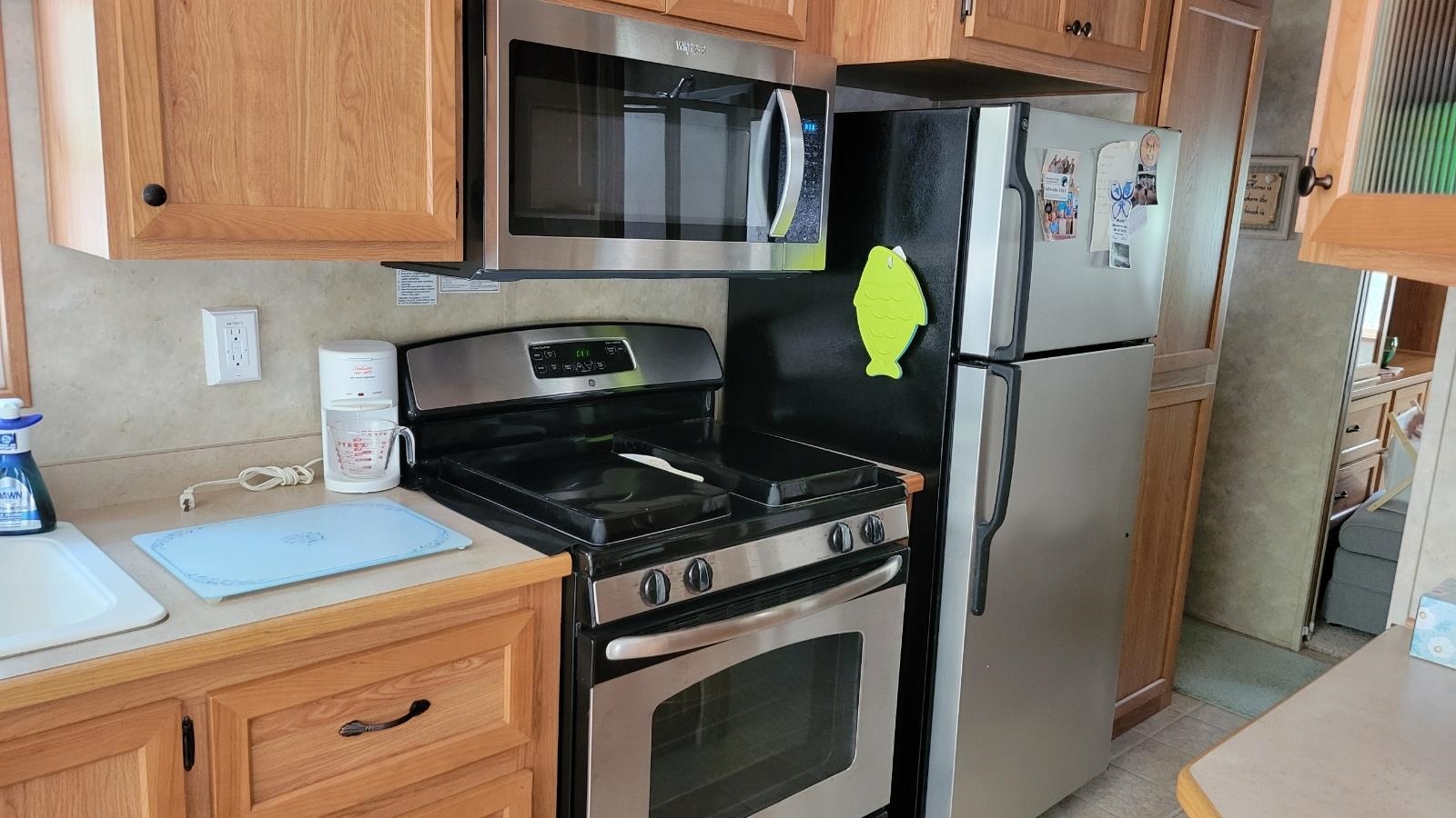 561 Corsons Tavern Road Ocean View, NJ 08230 - Photo 13 of 31 a kitchen with stainless steel appliances granite countertop a refrigerator stove and microwave