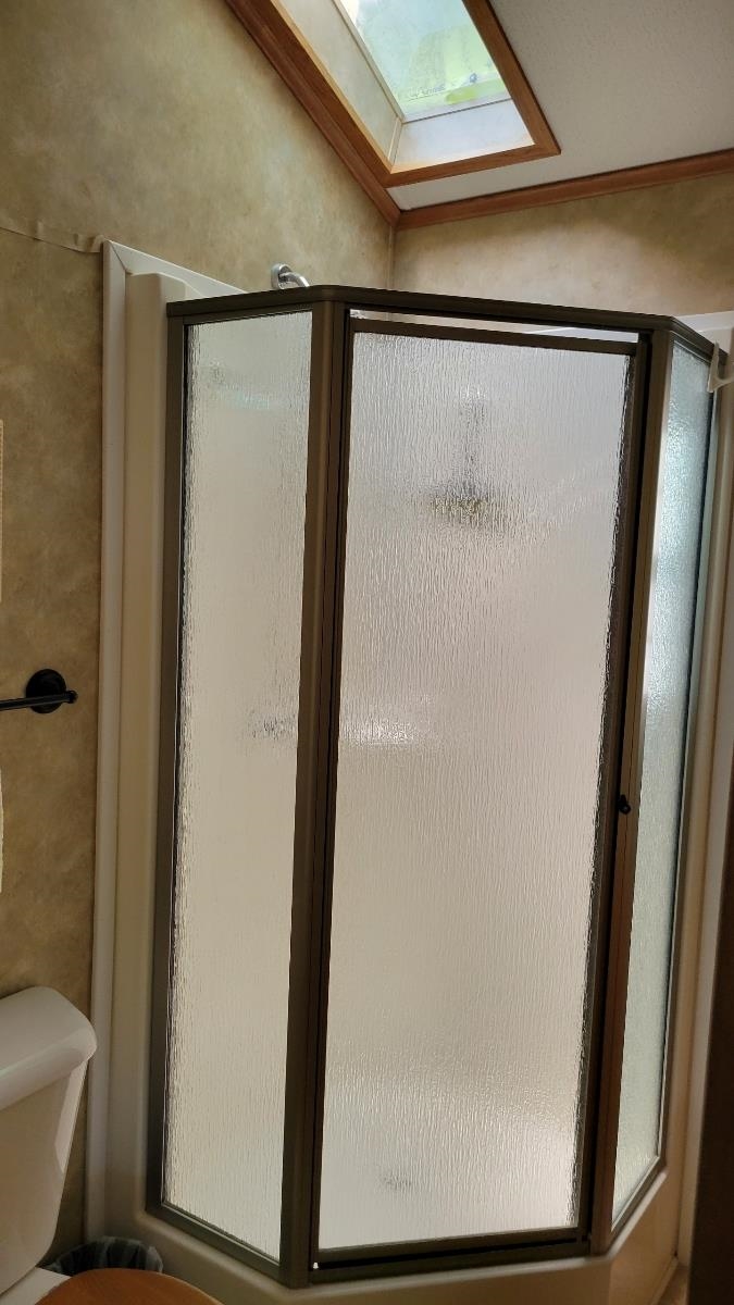 561 Corsons Tavern Road Ocean View, NJ 08230 - Photo 15 of 31 a bathroom with a glass shower door