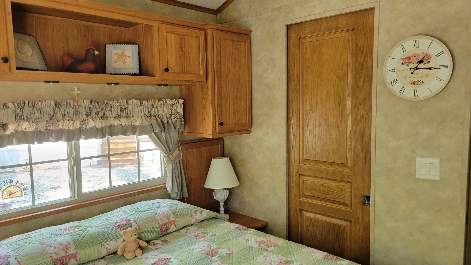 561 Corsons Tavern Road Ocean View, NJ 08230 - Photo 20 of 31 a bedroom with a bed and a window
