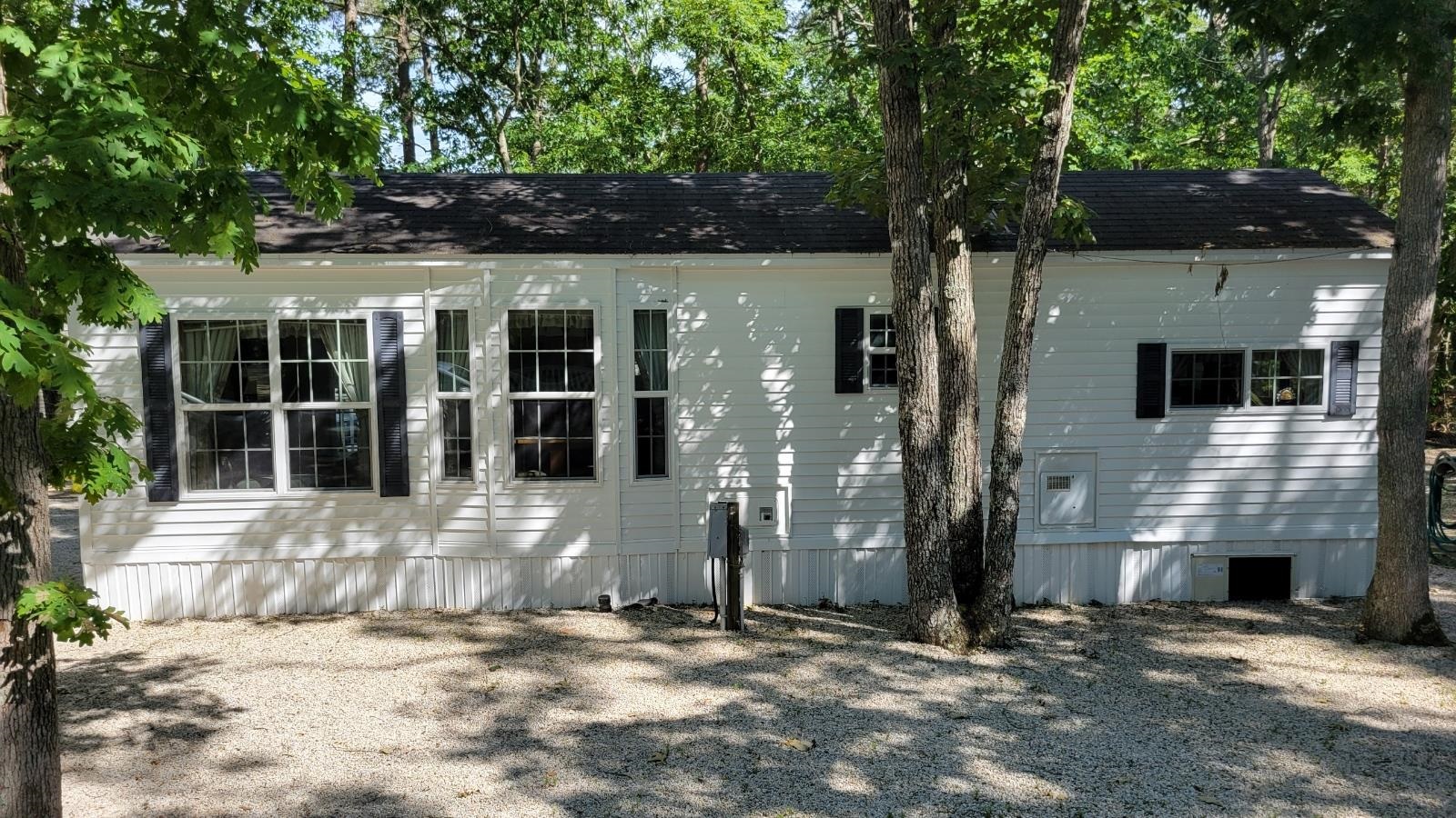 561 Corsons Tavern Road Ocean View, NJ 08230 - Photo 2 of 31 a front view of a house with a yard