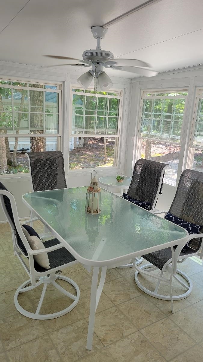561 Corsons Tavern Road Ocean View, NJ 08230 - Photo 24 of 31 a view of a dining room with furniture wooden floor and a chandelier