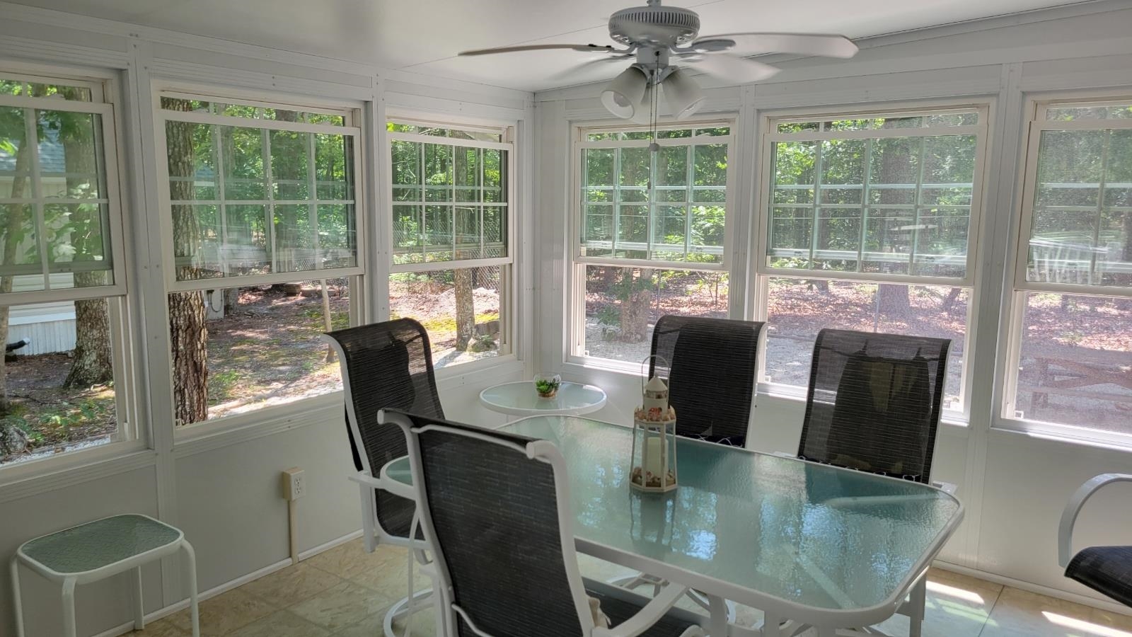561 Corsons Tavern Road Ocean View, NJ 08230 - Photo 25 of 31 a view of a dining room with furniture large windows and wooden floor