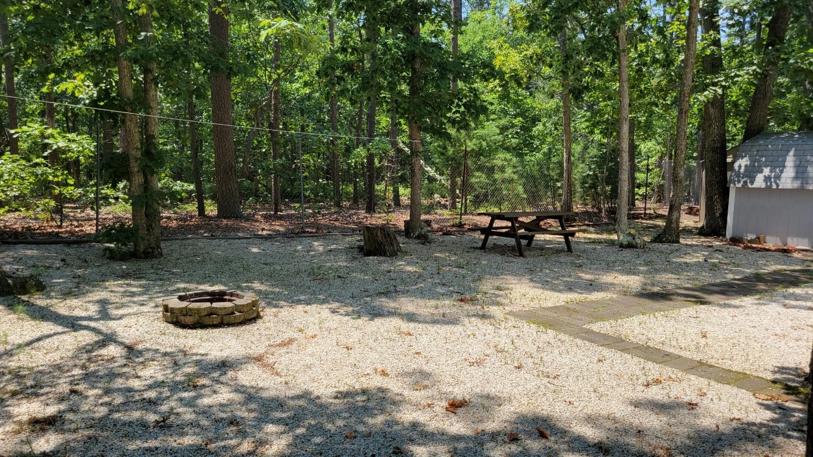 561 Corsons Tavern Road Ocean View, NJ 08230 - Photo 29 of 31 a backyard of a house with table and chairs