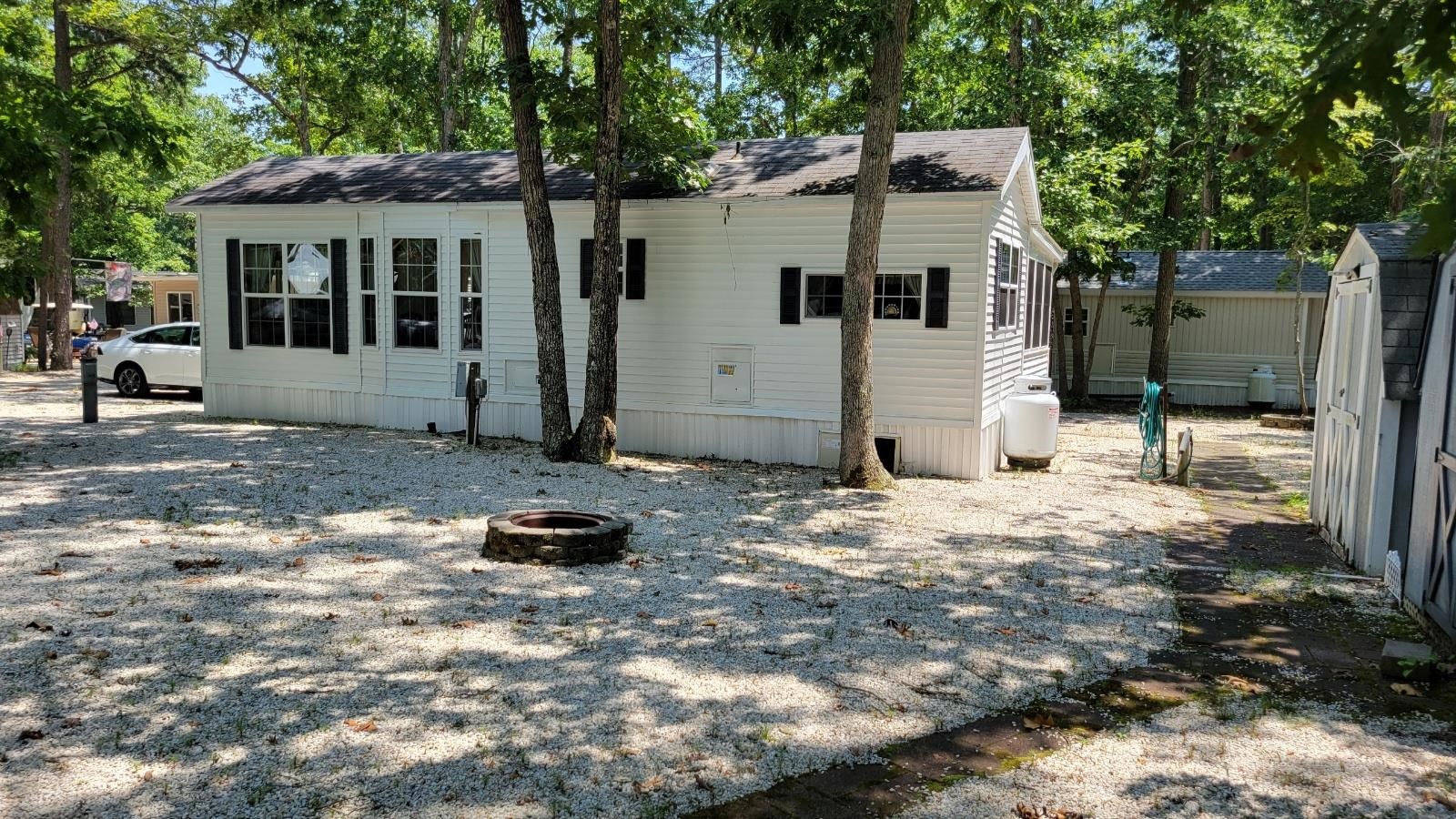 561 Corsons Tavern Road Ocean View, NJ 08230 - Photo 30 of 31 a front view of a house with a yard