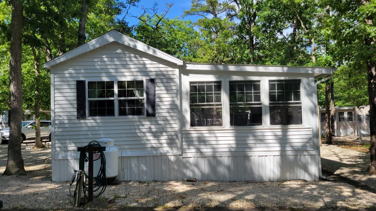 561 Corsons Tavern Road Ocean View, NJ 08230 - Photo 4 of 31 front view of a house with a yard