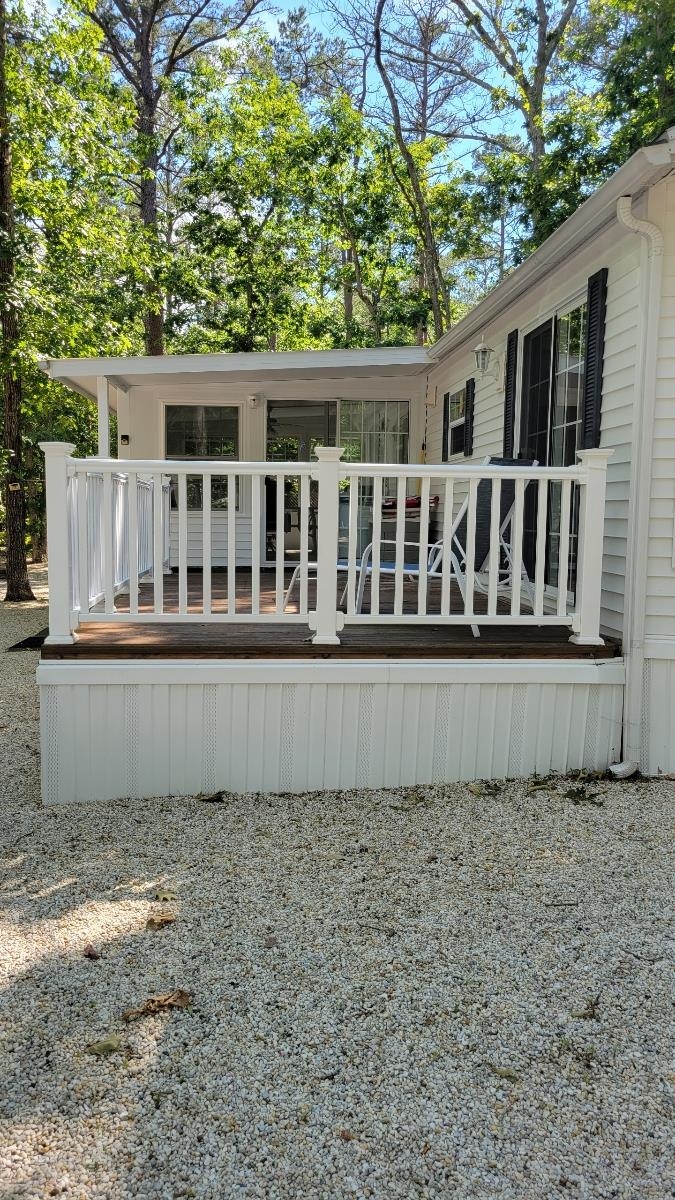 561 Corsons Tavern Road Ocean View, NJ 08230 - Photo 6 of 31 a front view of a house with a garden