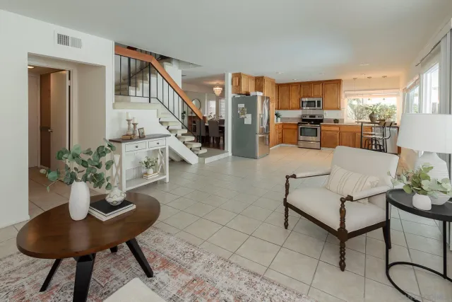 a living room with furniture and a potted plant