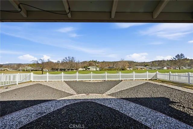 a view of swimming pool with outdoor space and mountain in the back