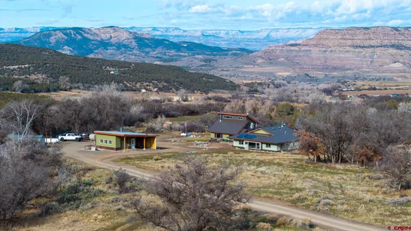 an aerial view of residential houses with outdoor space