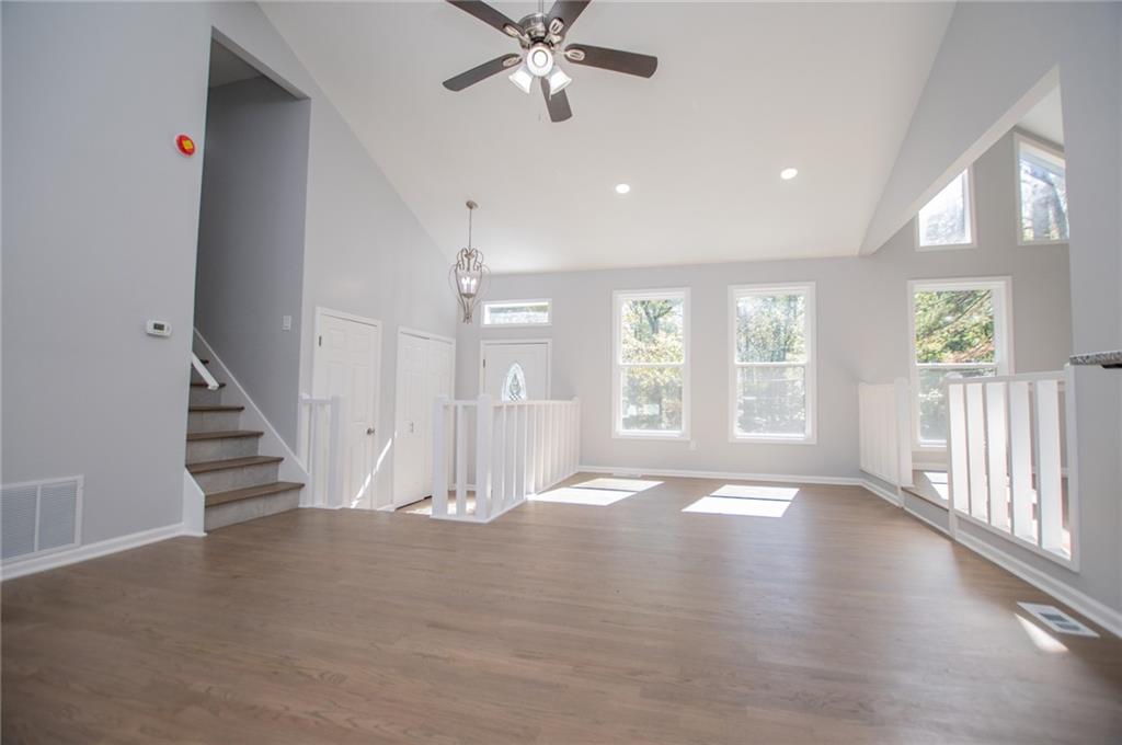 1039 Monticello Drive Villa Rica, GA 30180 - Photo 11 of 96 an empty room with wooden floor and windows