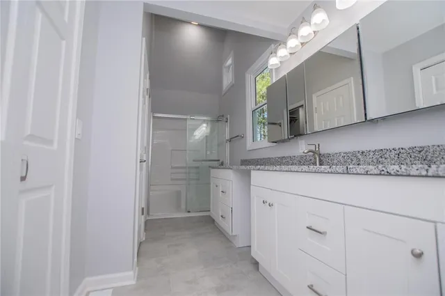 a view of yard with swimming pool and seating area