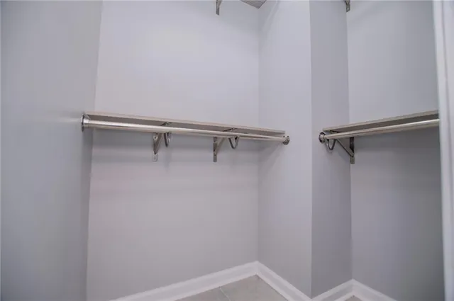 a view of a room with wooden floor and trees