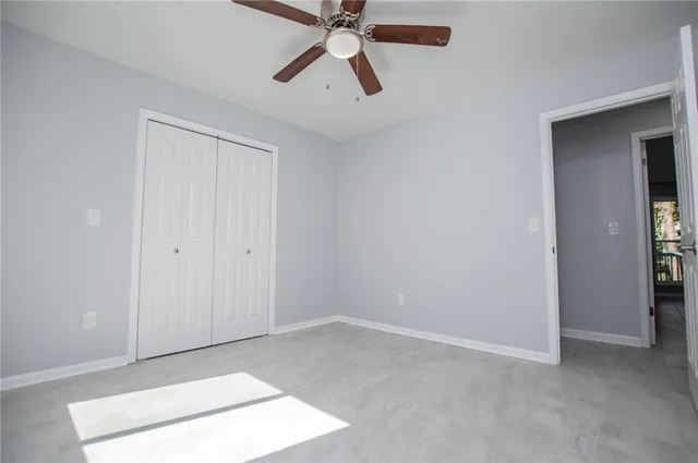 an aerial view of a houses with a yard and swimming pool