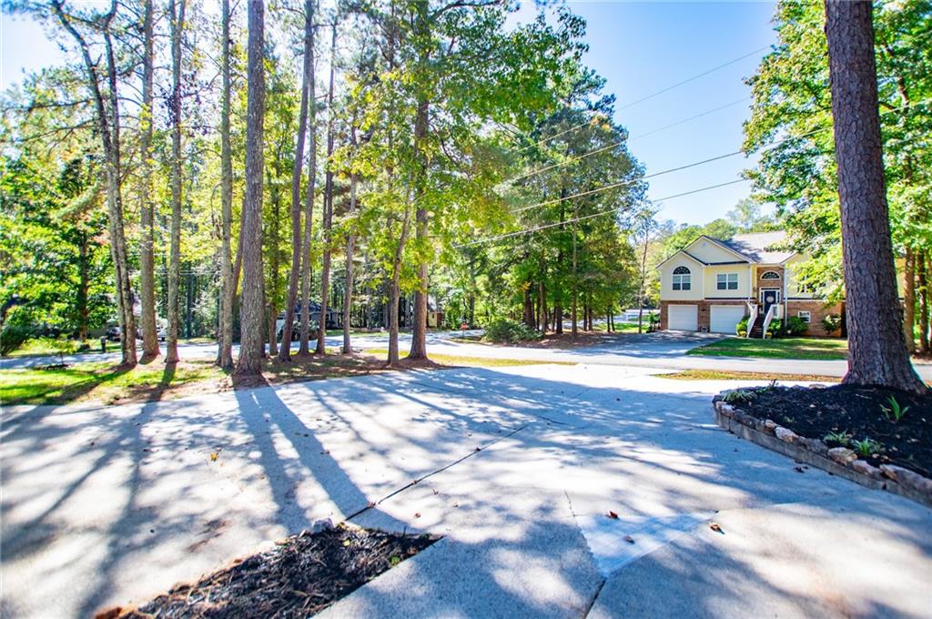 1039 Monticello Drive Villa Rica, GA 30180 - Photo 69 of 96 a view of yard with swimming pool and seating area