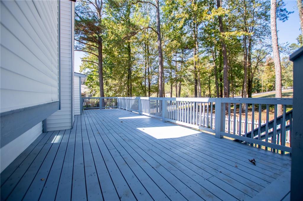1039 Monticello Drive Villa Rica, GA 30180 - Photo 79 of 96 a view of a room with wooden floor and trees