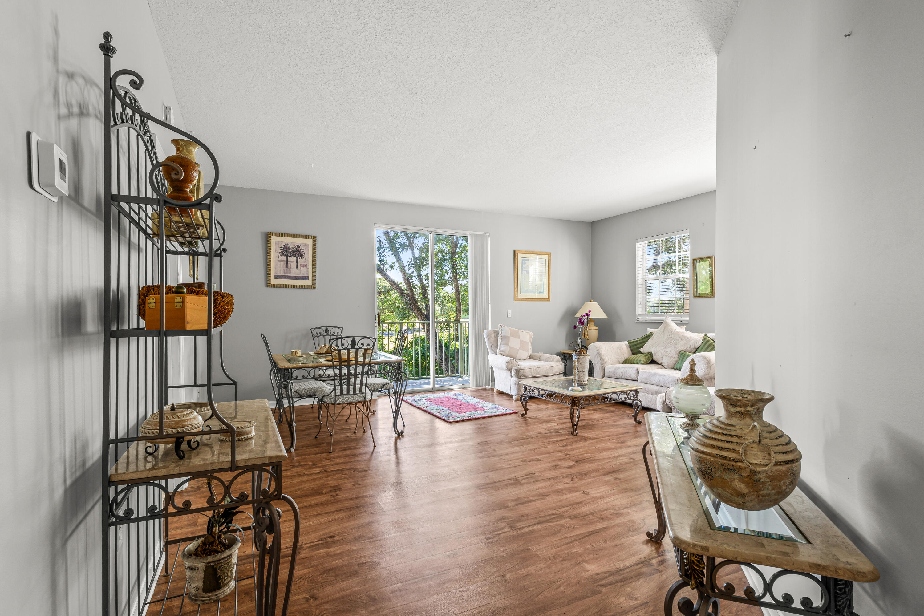 1951 Brandywine Road, Unit 59303 West Palm Beach, FL 33409 - Photo 4 of 25 a living room with furniture and wooden floor