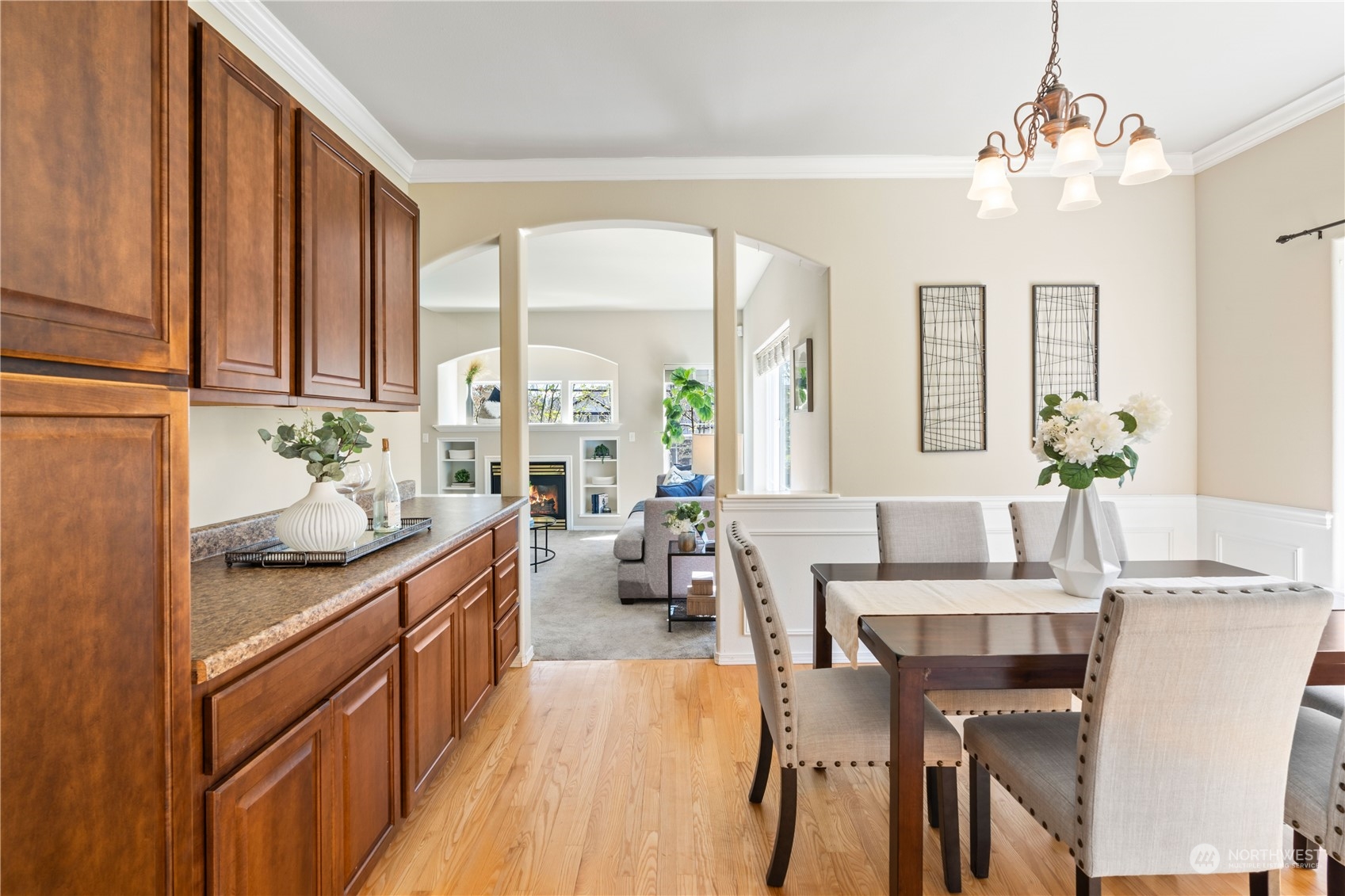 218 170th Place Southeast Bothell, WA 98012 - Photo 8 of 29 a dining hall with stainless steel appliances kitchen island granite countertop a table and chairs in it