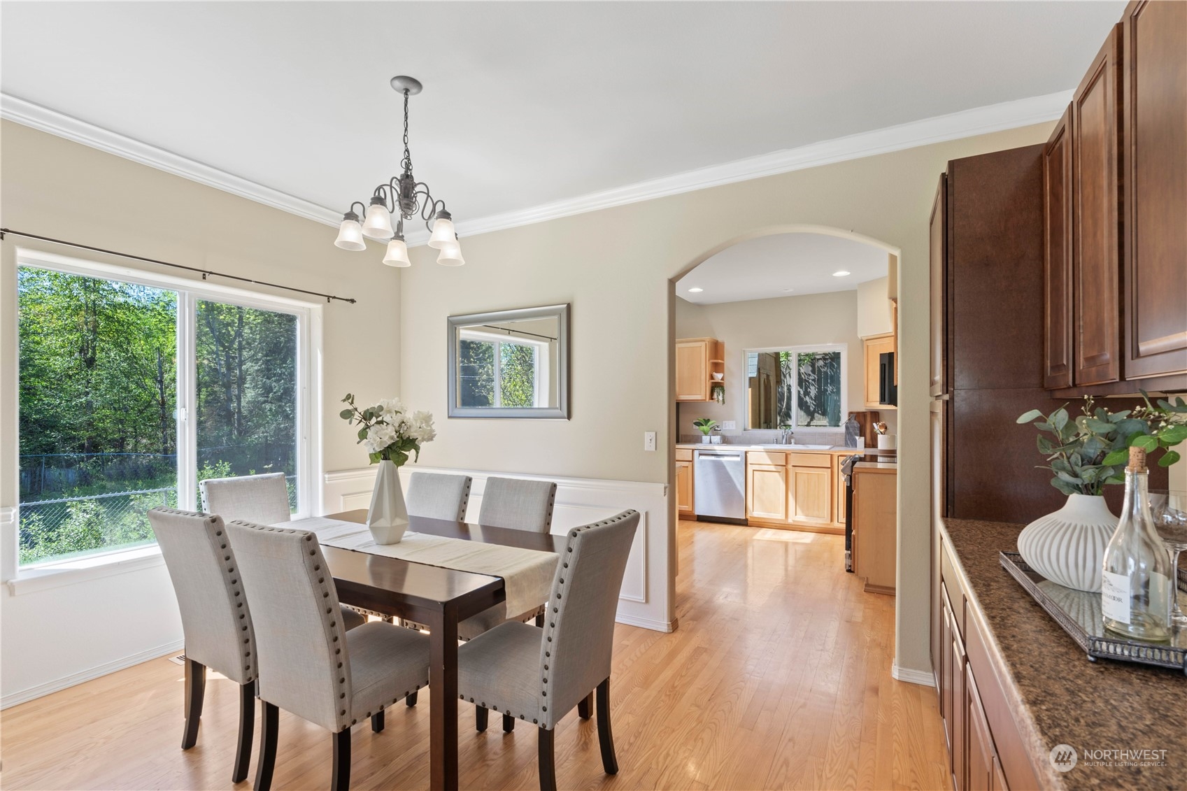 218 170th Place Southeast Bothell, WA 98012 - Photo 9 of 29 a view of a dining room with furniture window and wooden floor