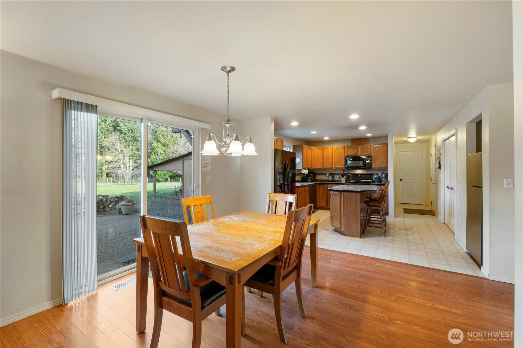 2219 Key Peninsula Highway Southwest Lakebay, WA 98349 - Photo 12 of 40 a view of a dining room with furniture window and wooden floor