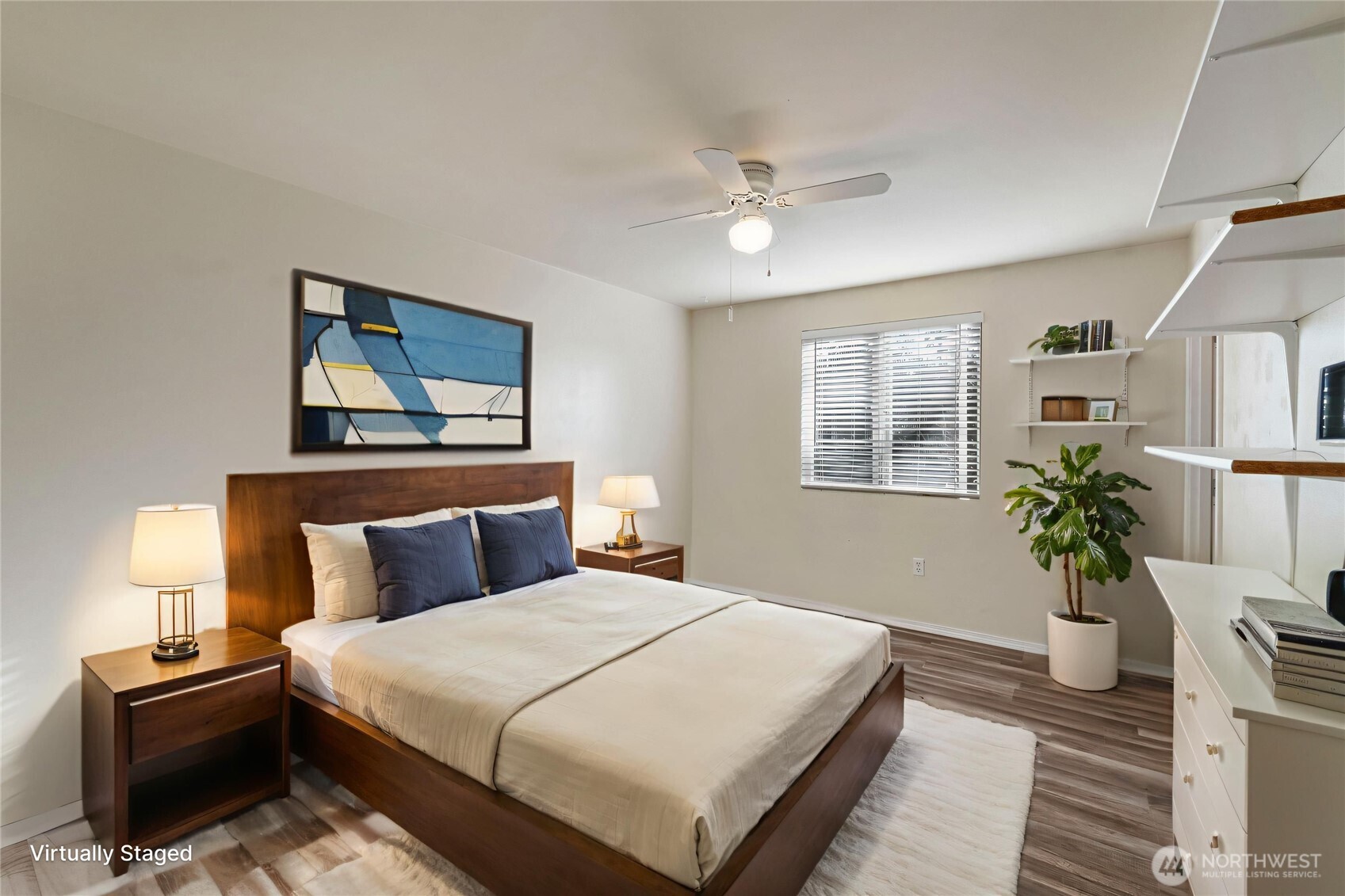 2219 Key Peninsula Highway Southwest Lakebay, WA 98349 - Photo 21 of 40 a bedroom with a large bed and a chandelier