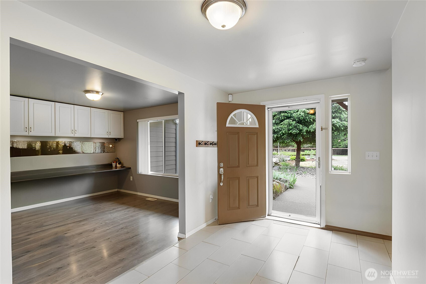 2219 Key Peninsula Highway Southwest Lakebay, WA 98349 - Photo 6 of 40 a kitchen with stainless steel appliances granite countertop a refrigerator and a sink