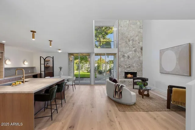 a living room with furniture a window and a table