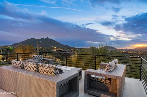 a view of a terrace with couches and wooden floor