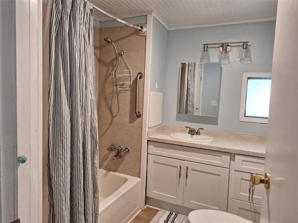 886 Pecan Circle Sebastian, FL 32976 - Photo 12 of 17 a bathroom with a sink toilet and shower
