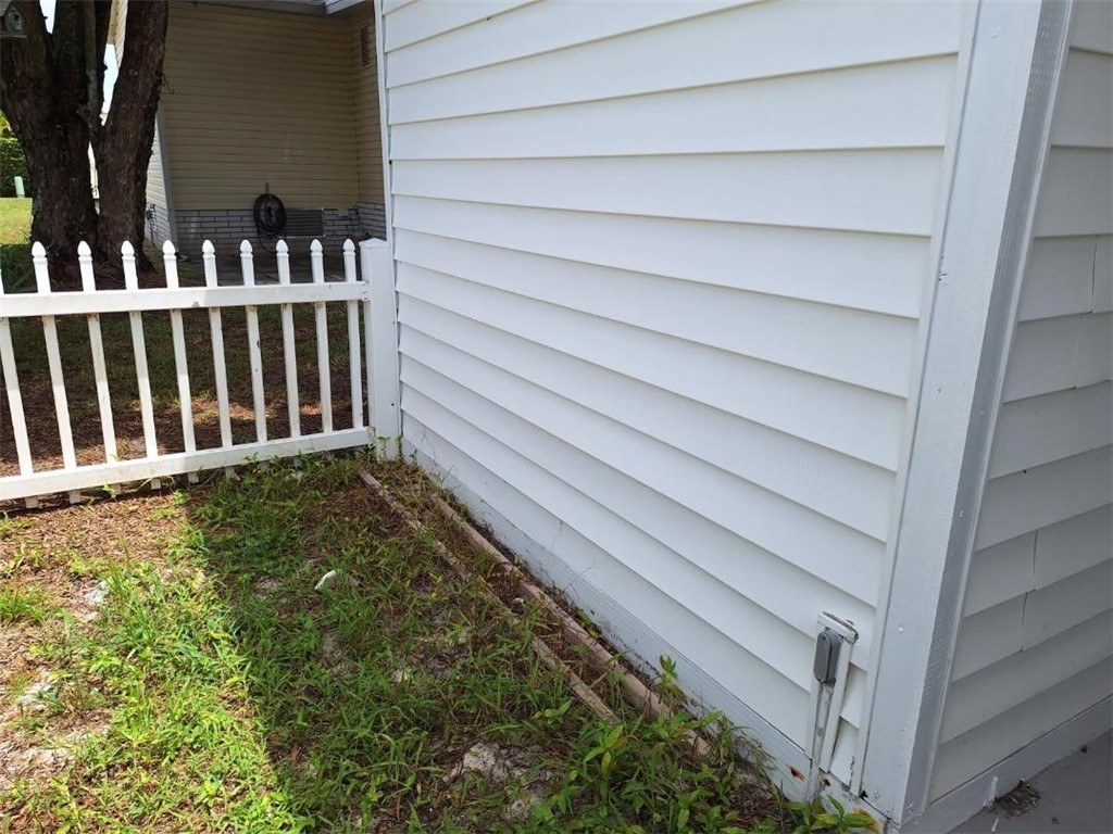 886 Pecan Circle Sebastian, FL 32976 - Photo 3 of 17 a view of a house with a wooden fence