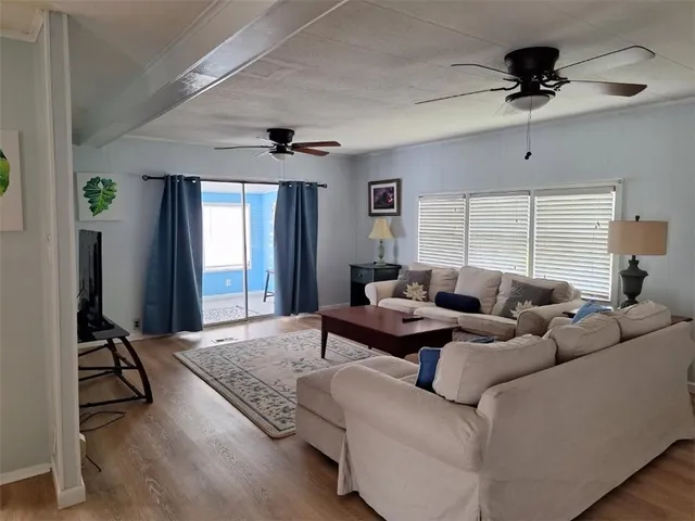 a living room with furniture and a window
