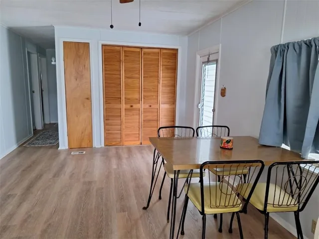 a view of a dining room with furniture window and outside view