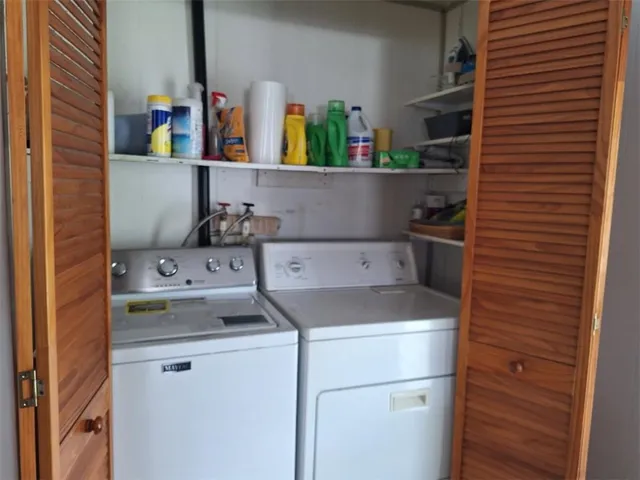 a utility room with dryer and washer