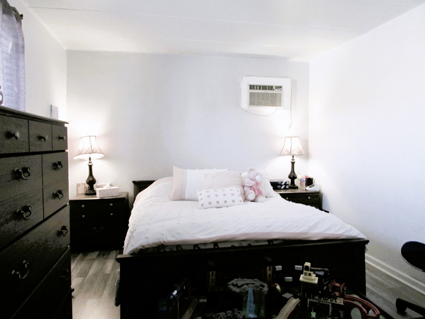 10611 Parkside Avenue, Unit 202 Chicago Ridge, IL 60415 - Photo 14 of 22 a bedroom with a bed and a night stand