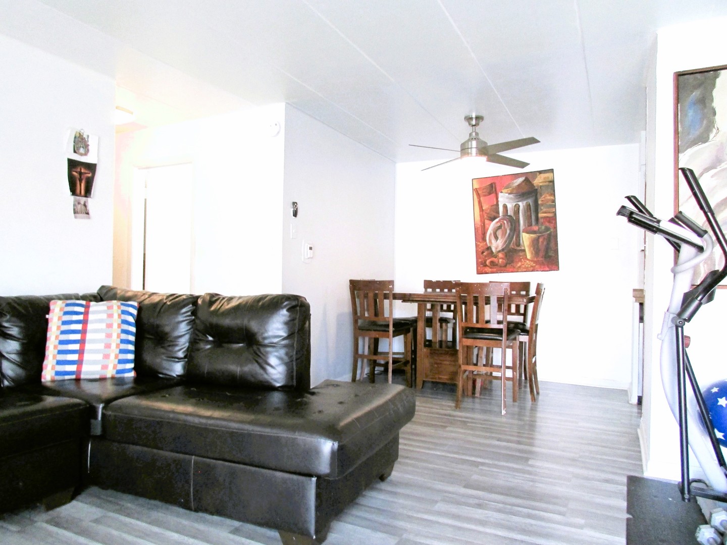 10611 Parkside Avenue, Unit 202 Chicago Ridge, IL 60415 - Photo 10 of 22 a living room with furniture and a wooden floor
