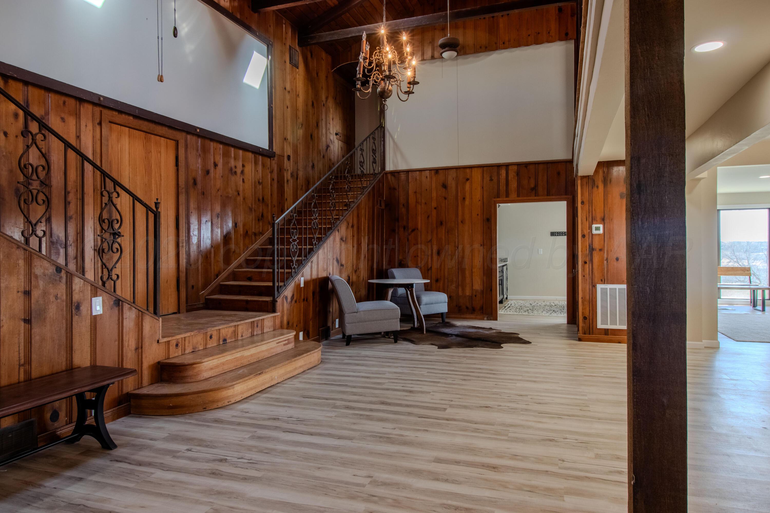 401 10 Bears Trail Howardwick, TX 79226 - Photo 14 of 71 a view of a living room with stairs and furniture