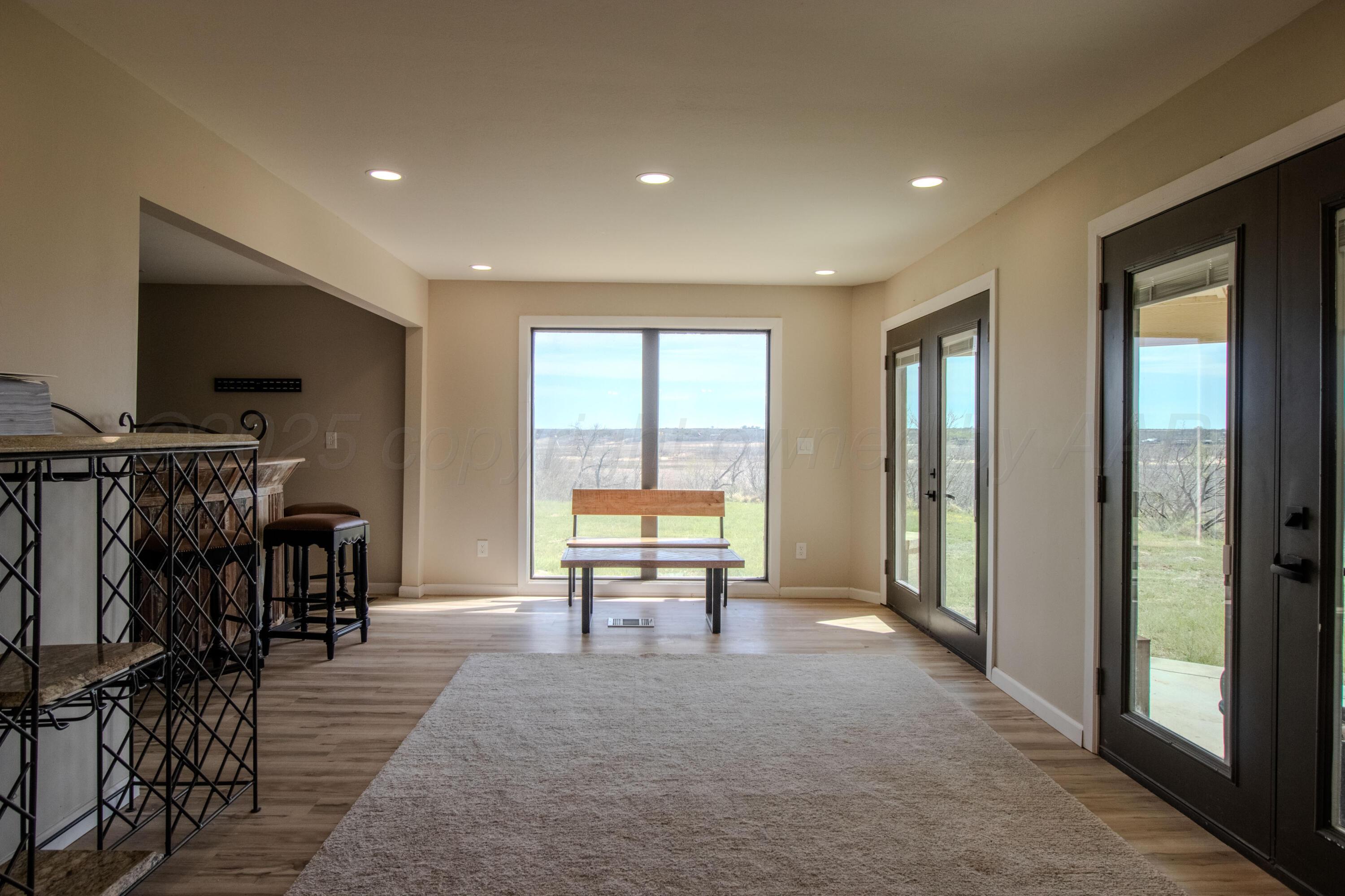 401 10 Bears Trail Howardwick, TX 79226 - Photo 17 of 71 a living room with furniture and a flat screen tv