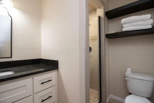 a bedroom with a bed and a tv