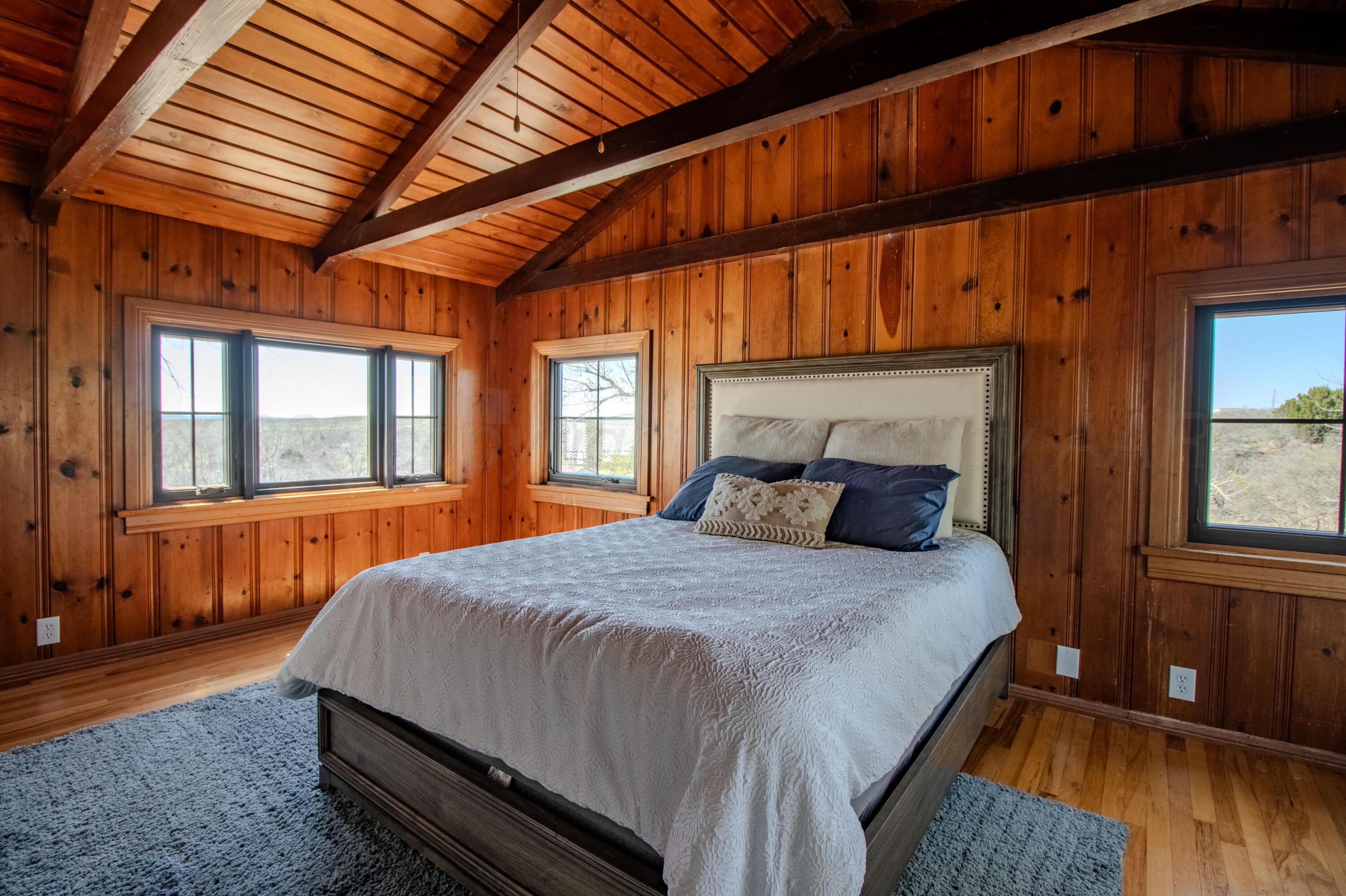 401 10 Bears Trail Howardwick, TX 79226 - Photo 27 of 71 a bedroom with a bed and wooden floor