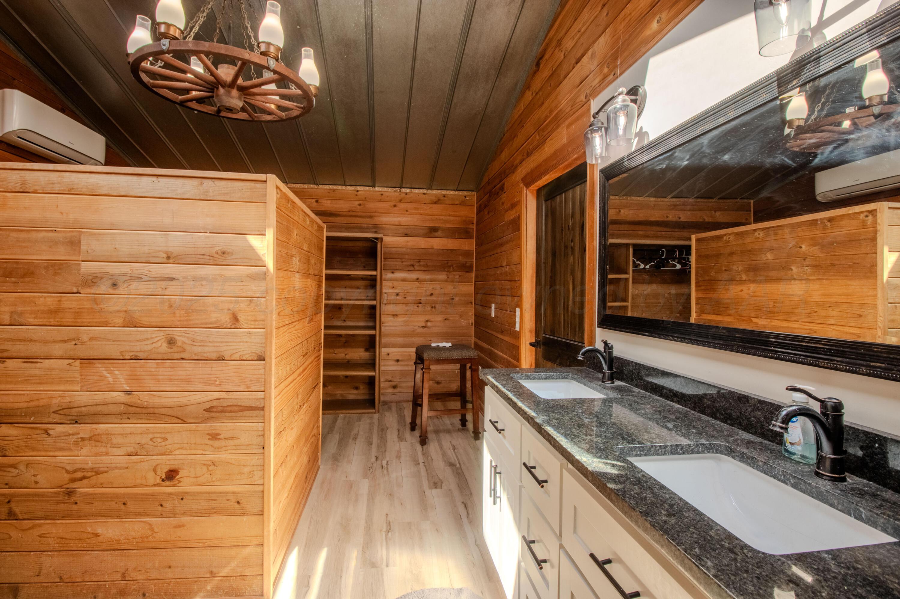 401 10 Bears Trail Howardwick, TX 79226 - Photo 35 of 71 a bathroom with a granite countertop sink a vanity and a mirror