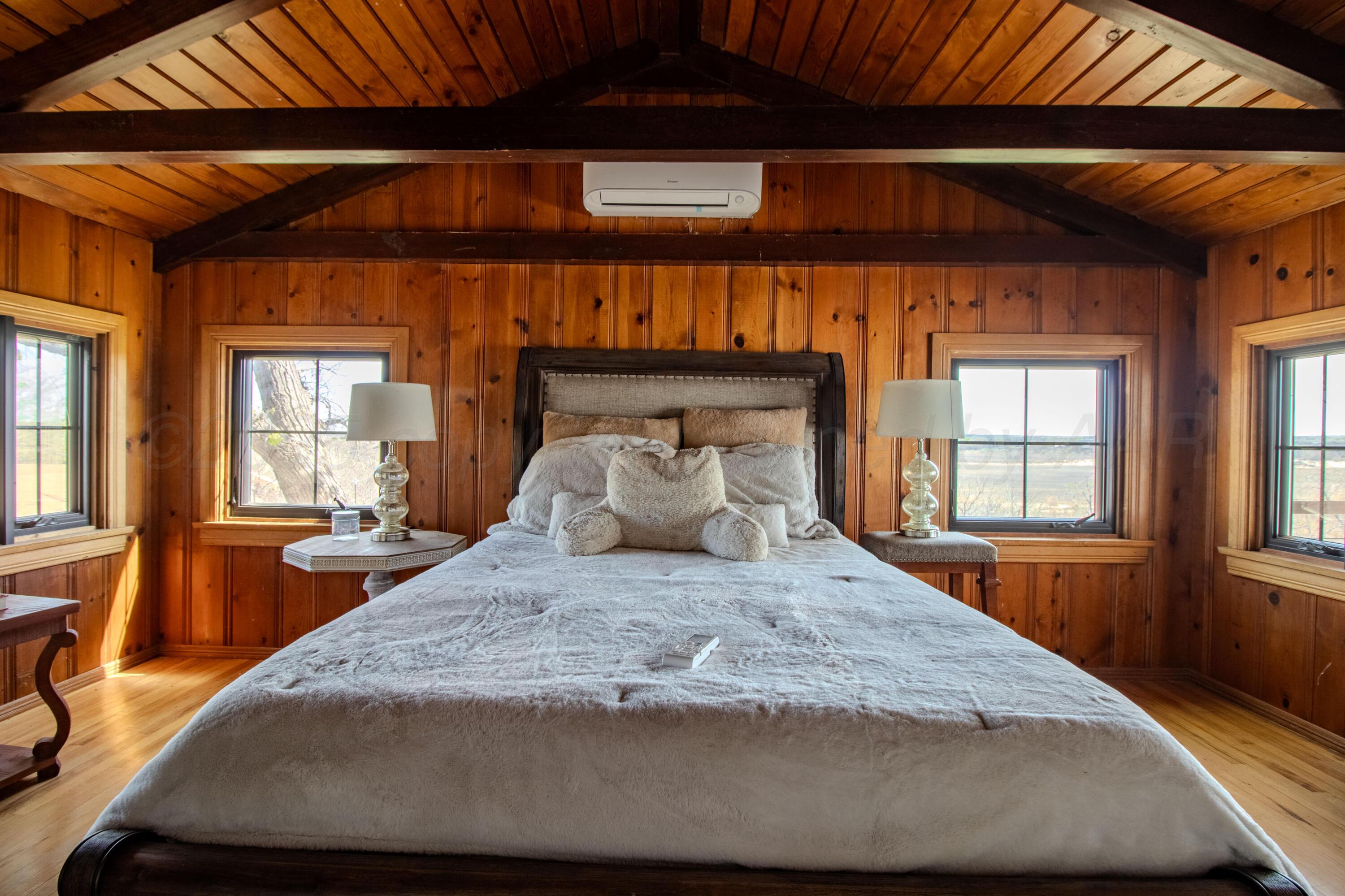 401 10 Bears Trail Howardwick, TX 79226 - Photo 38 of 71 a large bed in a bedroom next to a window