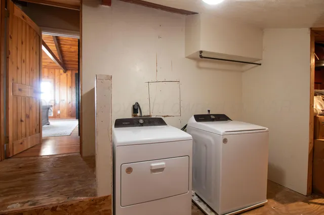 a view of a backyard with a tree