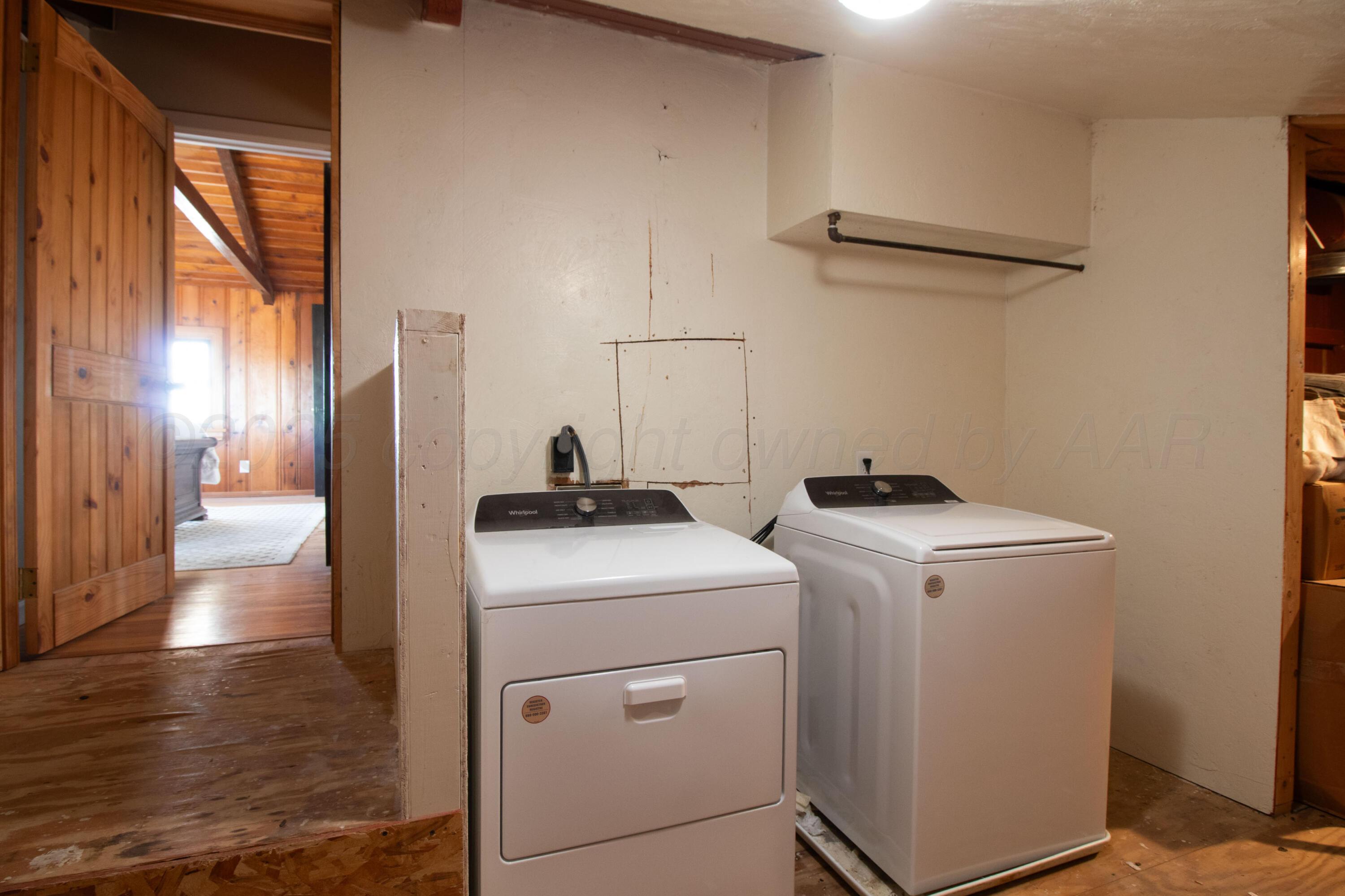 401 10 Bears Trail Howardwick, TX 79226 - Photo 39 of 71 a view of storage and utility room with washer and dryer