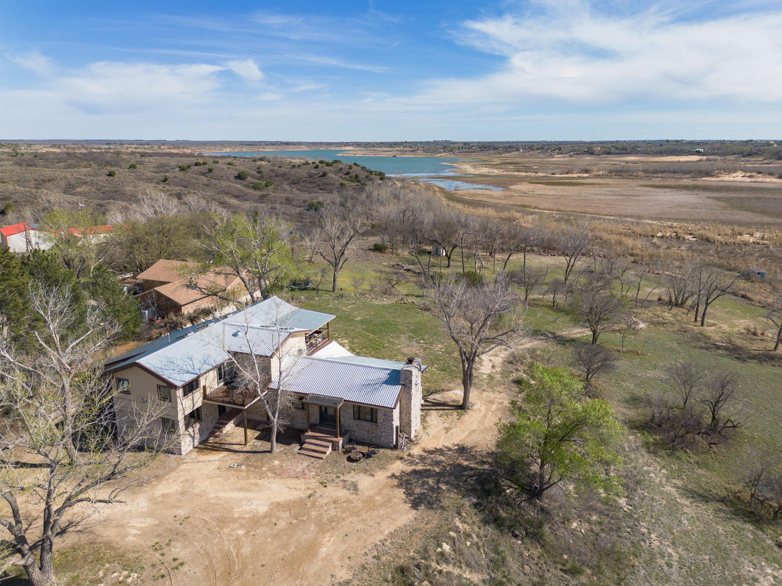 401 10 Bears Trail Howardwick, TX 79226 - Photo 4 of 71 an aerial view of a house with a ocean view