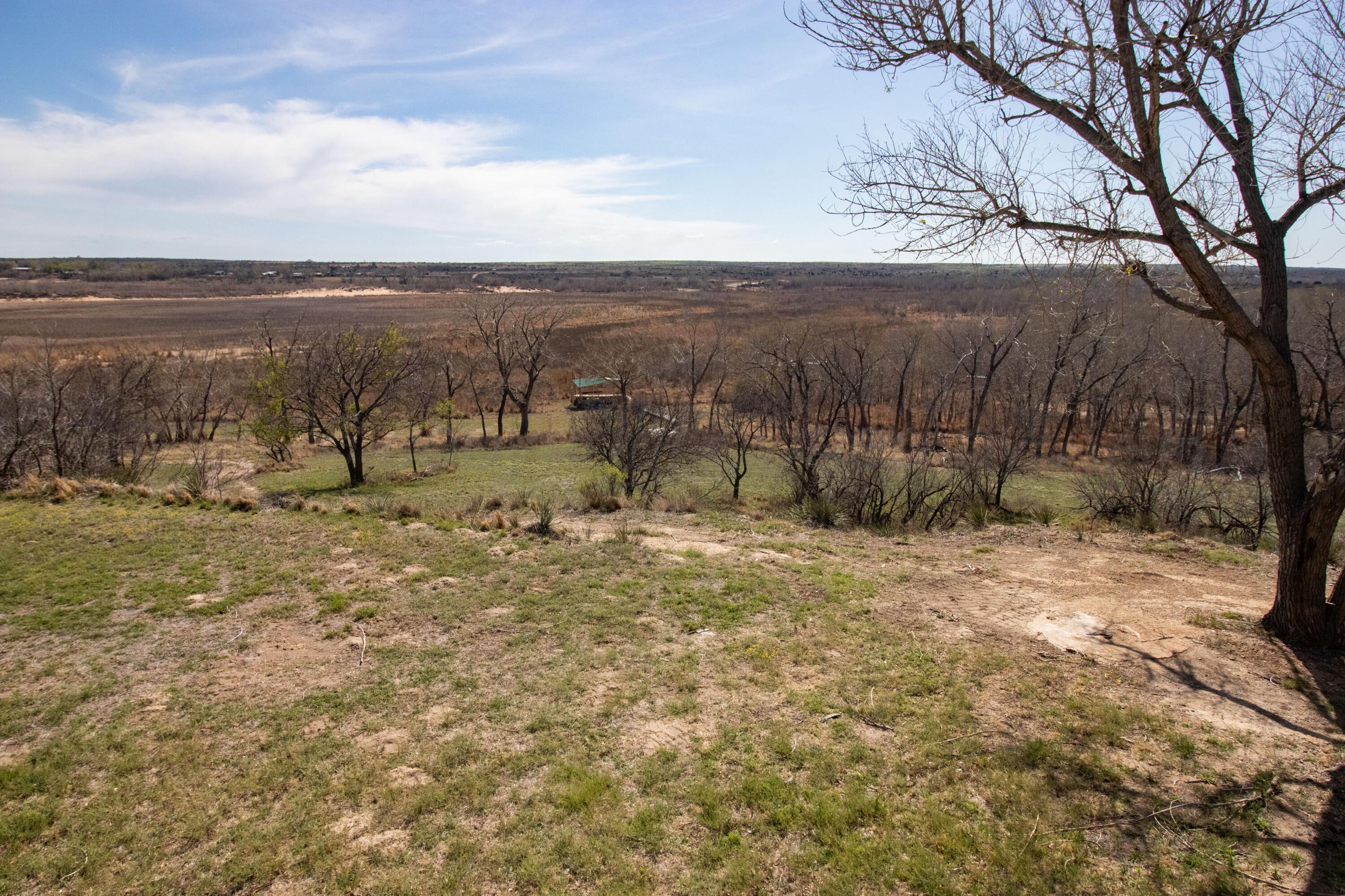 401 10 Bears Trail Howardwick, TX 79226 - Photo 44 of 71 a view of a field with wooden fence