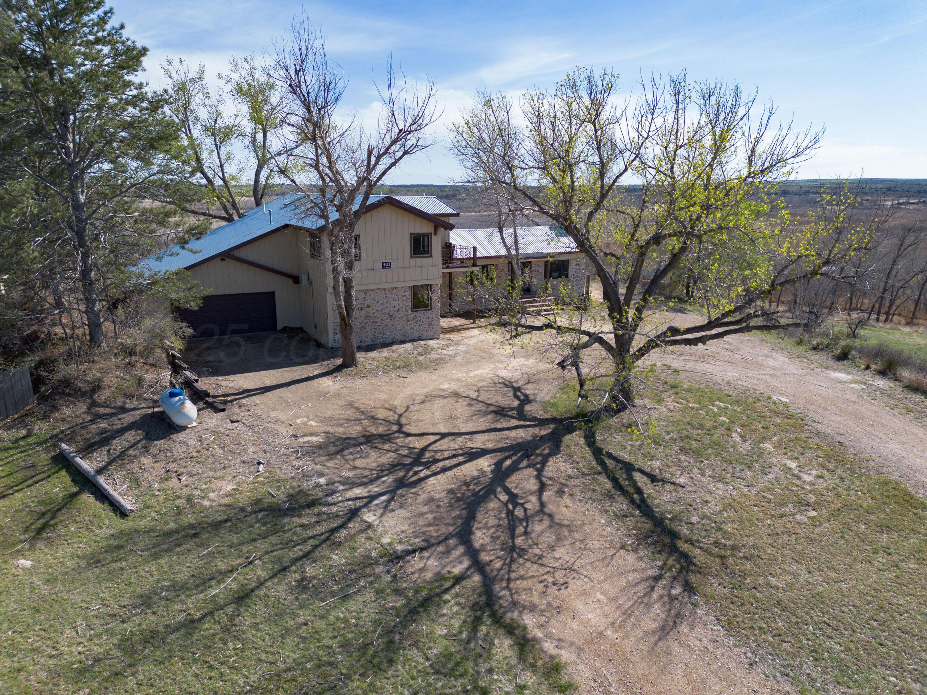 401 10 Bears Trail Howardwick, TX 79226 - Photo 52 of 71 a house that has a tree in front of it