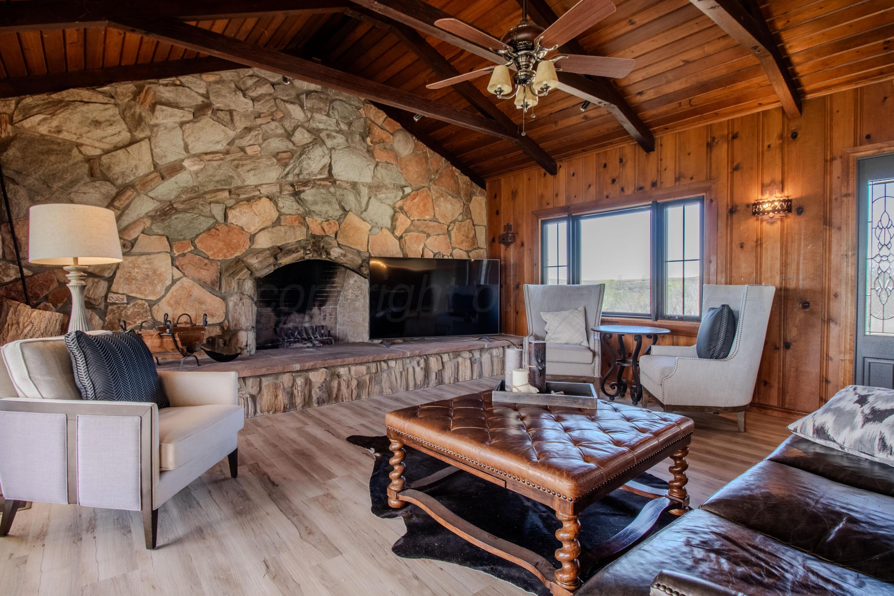 401 10 Bears Trail Howardwick, TX 79226 - Photo 7 of 71 a living room with furniture and a fireplace