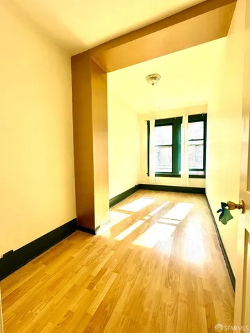 a view of an empty room with a window